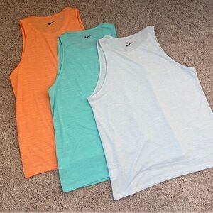 Nike Women’s Tank Tops in Vibrant Orange, Teal, and Light Blue-ish Gray